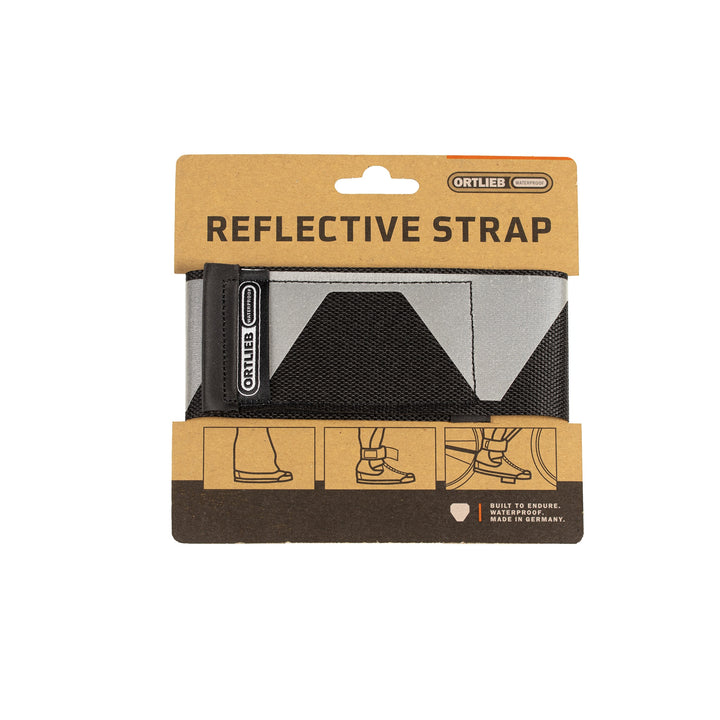ORTLIEB Reflective Strap, handgefertigte reflektierende Hosenklammer aus Restmaterialien, Vorderseite der Verpackung